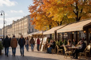 A vibrant weekend scene in Saint Petersburg during autumn, featuring people strolling along Nevsky Prospekt with colorful fall foliage, historic architecture in the background, cozy cafes with outdoor seating, and cultural events like street musicians or art fairs, capturing the lively atmosphere of October 2–4